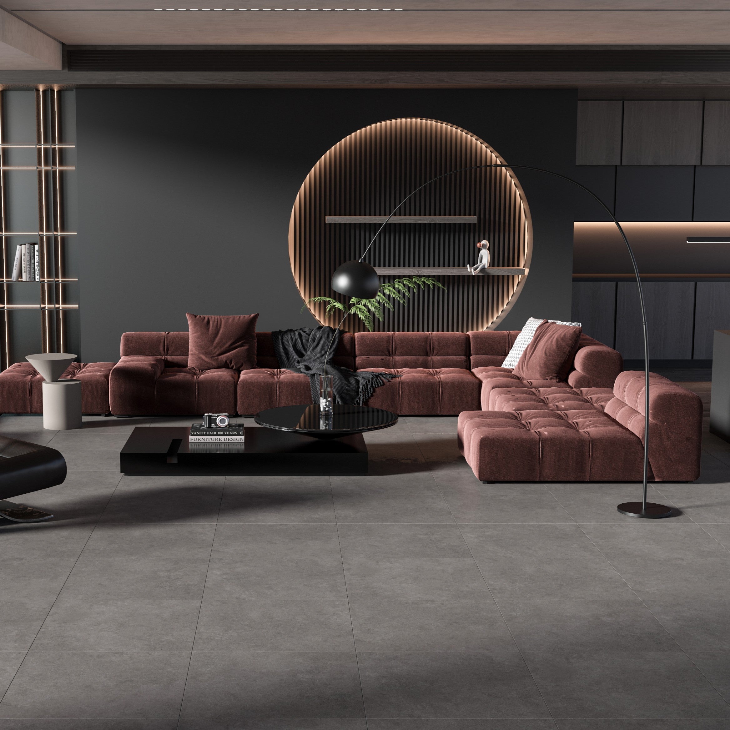 Modern living room with brown sectional sofa, dark coffee table, and decorative elements. Dark grey floor tile